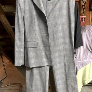 4-piece suit, pants, jacket, skirt and red sleeveless turtleneck